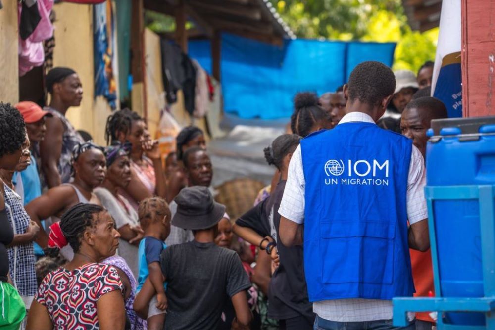 IOM staff interact with residents, ensuring they have access to necessary information and assistance. Photo Credit IOM 2024 / Antoine Lemonnier