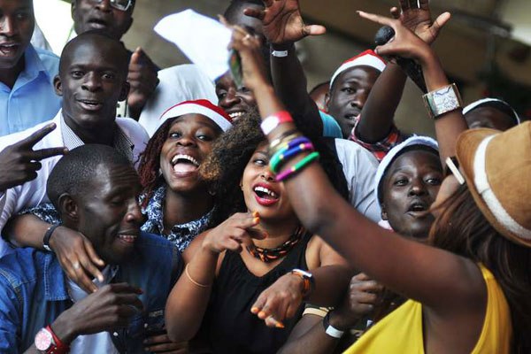 Kenyans attend a product launch in Nairobi. A new survey ranks Somalia as the happiest country in the East African region. It also says Kenyans would be happier were it not for corruption and low life expectancy in the country.