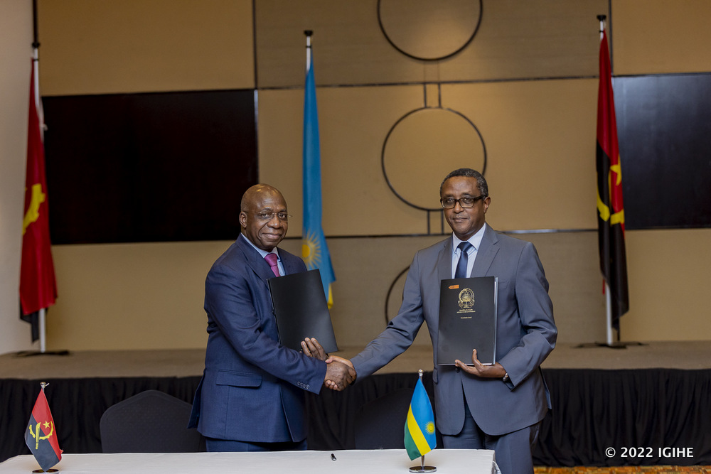 Minister Biruta and his counterpart of Angola shaking hands after signing MoUs. 