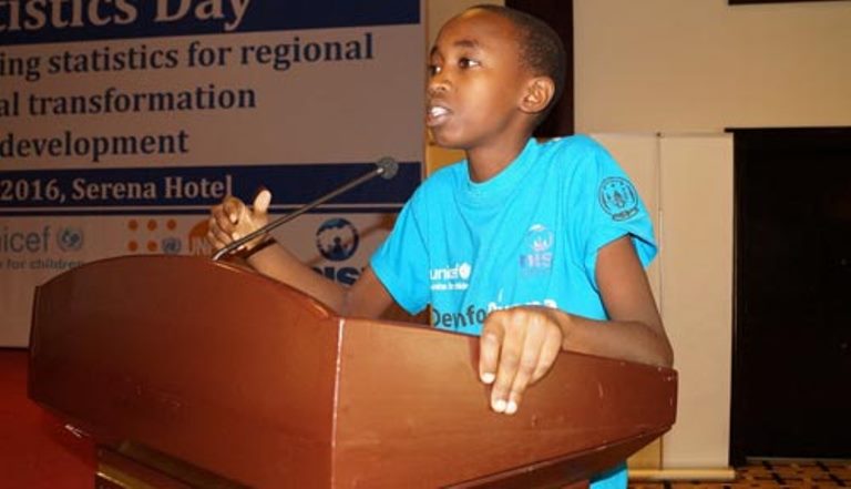 Josiah addresses a crowd of over 200 at the Africa Statistics Day celebration in Rwanda, presenting his ideas for a data-driven future.