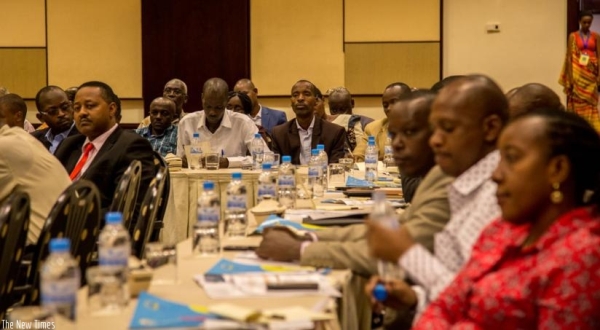 Participants follow a presentation on HIV AIDS prevalence in cities yesterday at Serena Hotel.