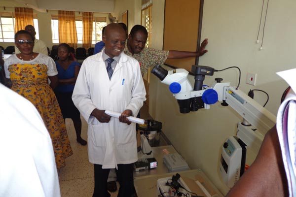 Senior Ophthalmic Clinical Officer in Moroto hospital, Mr Charles Pariyo explains the use of the eye care equipment to other hospital staff.