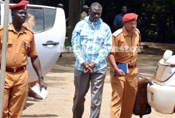 Moroto Prison warders prepare to transfer Dr Kizza Besigye (centre) to Luzira prison in Kampala last month. Dr Besigye was arrested in Kampala City centre on May 11, incarcerated first at Nalufenya in Jinja, then flown to Moroto in Karamoja, where he was charged with treason.