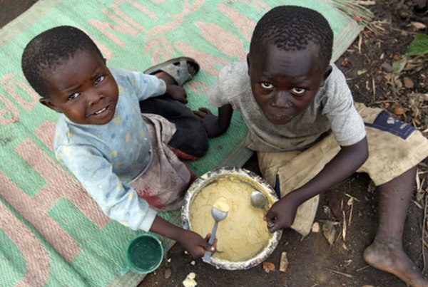 Children share a meal in Hoima district.