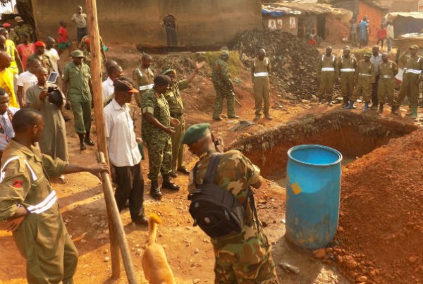 Gen Katumba Wamala joins other UPDF officers in the charity work of cleaning the environment on Tuesday, as part of the activities to mark Tarehe Sita.