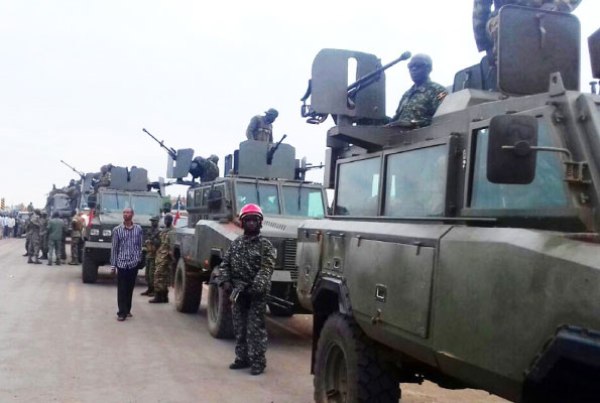 UPDF soldiers aboard war vehicles before they crossed into South Sudan through Elegu border post yesterday. Clashes in Juba between soldiers loyal to President Salva Kiir and the first Vice President, Dr Riek Machar, have claimed several lives since last week.