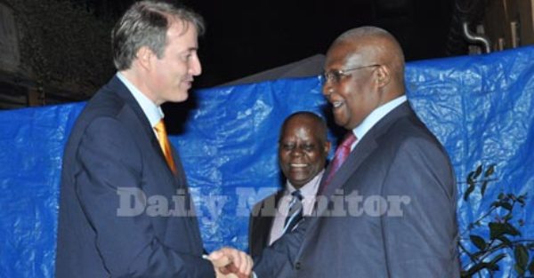 Head of European Union Delegation to Uganda Kristian Schmidt (left) shares a light moment with Foreign Affairs minister Sam Kutesa on the occasion to mark the Europe Day in Kampala on Monday.