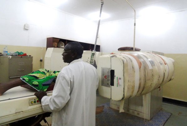 A physicist administers radiotherapy treatment to a cancer patient at Mulago hospital using the old Cobalt 60 machine bought 21 years ago.