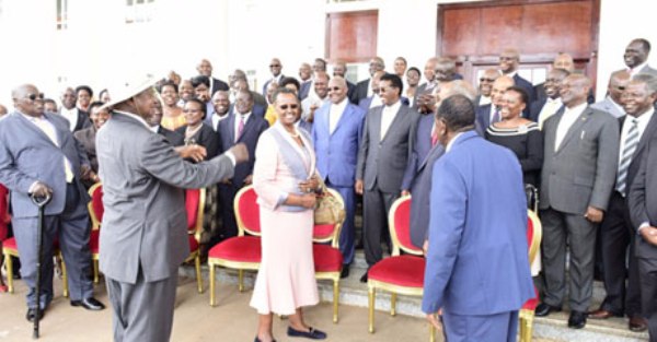 President Museveni (Left) chats with members of his current Cabinet during a send off at State House Entebbe on Wednesday.