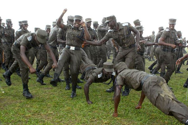 Cadet officers and probation police constables dance in the rain ahead of their pass out at the Police Training School, Kabalye, Masindi District, at the weekend.