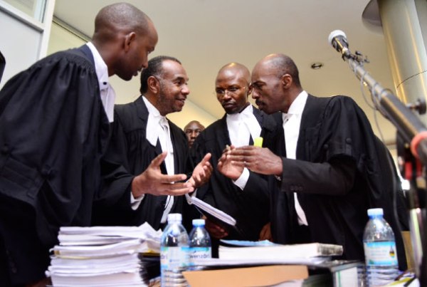 Mr Amama Mbabazi’s lawyers Jude Byamukama, Mohmed Mbabazi, Severino Twinobusingye and Michael Akampurira consult during a break at the Supreme Court yesterday.