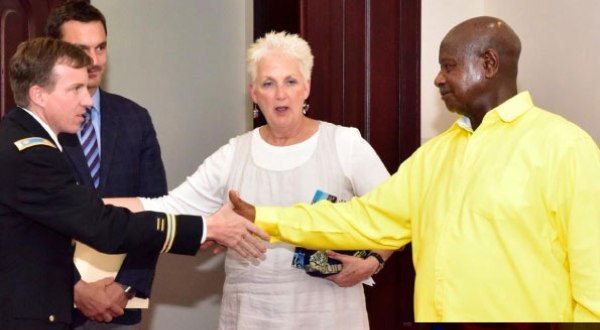 President Museveni (R) greets a European Union official as US Ambassador Deborah Malac (C) looks on following a meeting at State House Entebbe last Thursday.