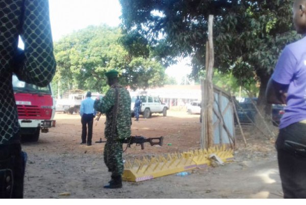 A soldier guards the main entrance to Gulu Central Police Station.