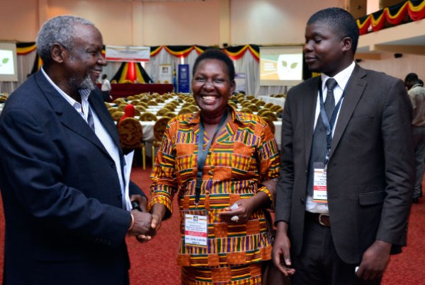 Left to right: Mr Baregu Mwesigu from Tanzania shares a light moment with Masindi District Woman MP Jalia Bintu as Bugahya MP Pius Wakabi looks on during the introduction of MPs at Imperial Royal Hotel in Kampala yesterday.