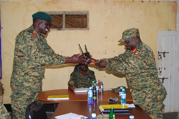 Duty. Maj Gen Peter Elwelu (right), hands over office to Brig Paul Lokech at the Second Division Army Barracks in Makenke, Mbarara at the weekend.