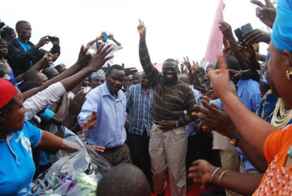 Former FDC presidential candidate Kizza Besigye flashes the FDC party symbol as he is welcomed by supporters at a rally in Kakyeka Stadium, Mbarara Municipality, at the weekend.