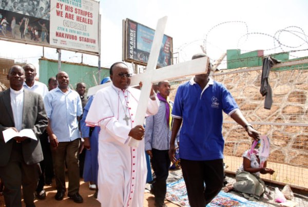 Kampala Archbishop Cyprian Kizito Luwanga (carrying a cross) leads Christians in a march to mark the Way of the Cross in Kampala on Good Friday.