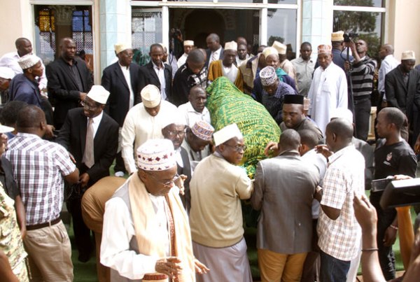 Mourners carry the body of Aziz Kasujja after prayers at Kibuli Mosque in Kampala yesterday.