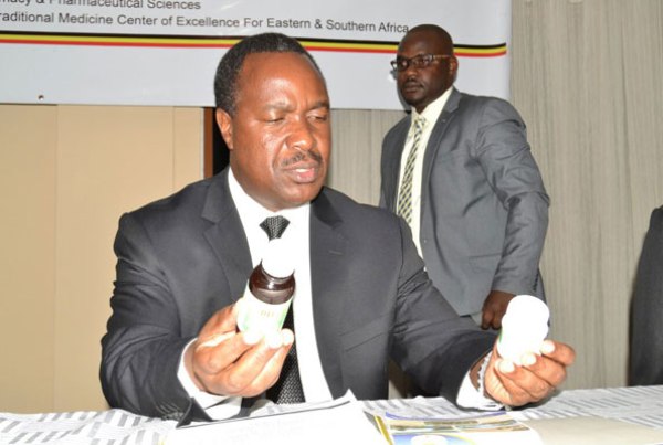 Minister for Science and Innovation Elioda Tumwesigye, displays some of the anti-malarial drug last week.