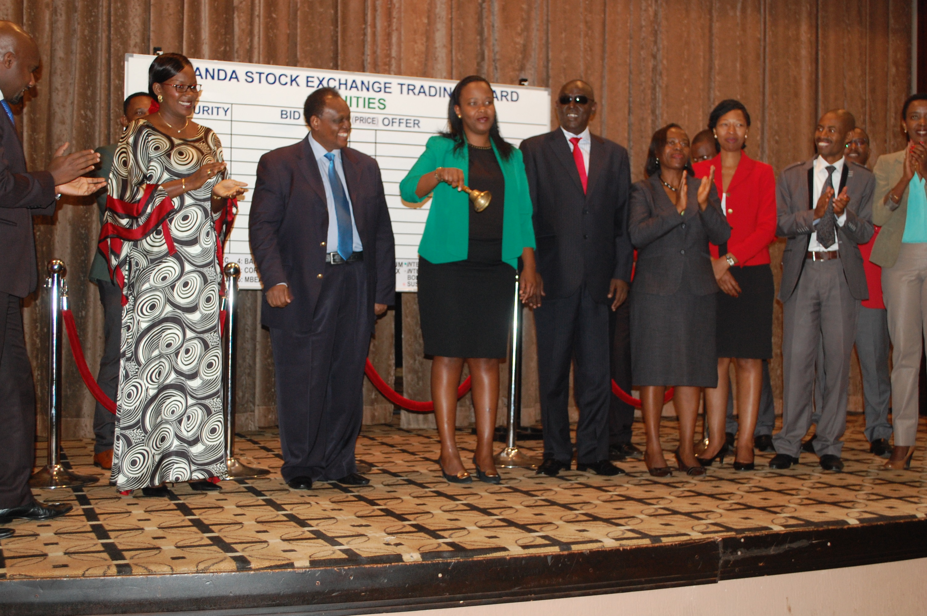 Hon. Akamanzi (center) rings the bell signifying start of trading yesterday as the RSE embarked on promoting gender equality.
