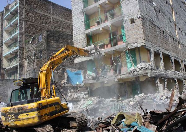 An excavator demolishes a residential building in Huruma estate on May 7, 2016 that was considered unsafe. For most of Huruma residents the problem is not the time to look for alternative housing, but the money to pay rent in any of the buildings that have escaped demolition.