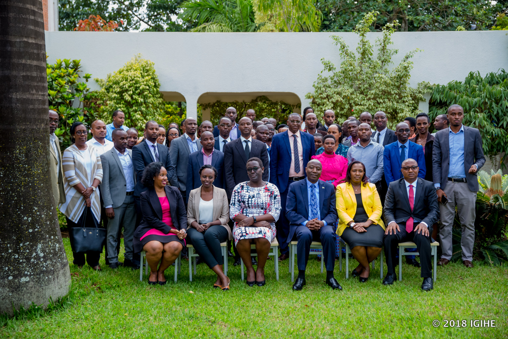 Officials take a group photo after the handover ceremony