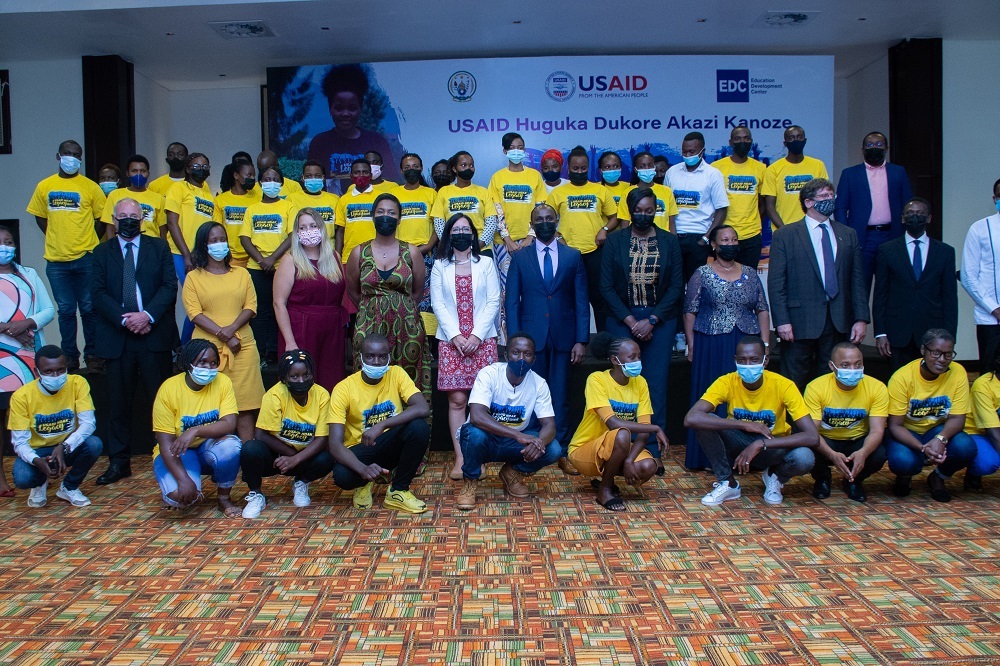 Project beneficiaries in a group photo with officials.