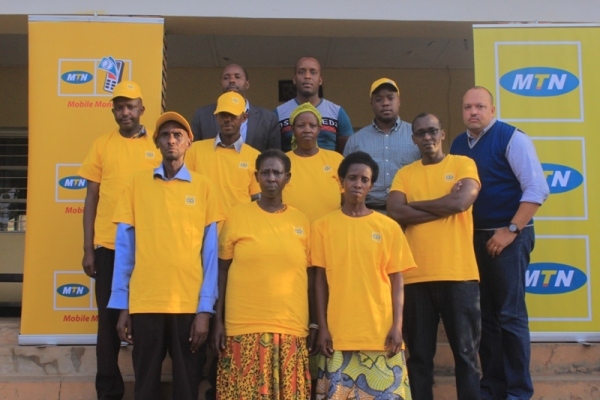 MTN staff pose for a photo with Mutuelle de santé beneficiaries in Nyagatare district