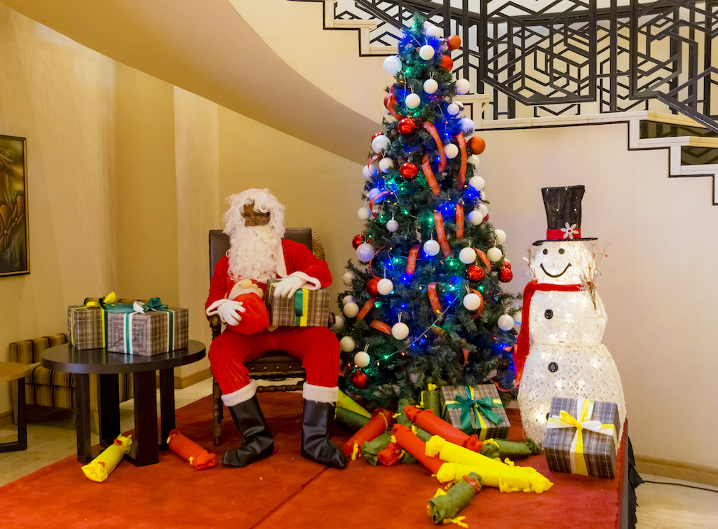 Lively with Christmas cheer, Santa Claus was wishing the young a Merry Christmas
