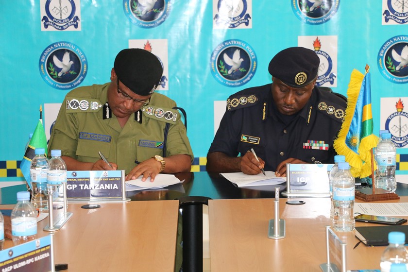 IGP Emmanuel K. Gasana and his counterpart of Tanzania, IGP Ernest J. Mangu, signing the resolutions of the meeting.