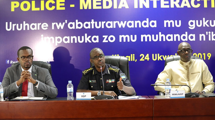 IGP Dan Munyuza, flanked by Justice Minister, Johnston Busingye (R) and Prosecutor General, Jean Bosco Mutangana.