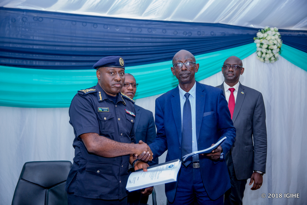 Inspector General of Police, Emmanuel Gasana hands the laboratory to Director, Sinayobye