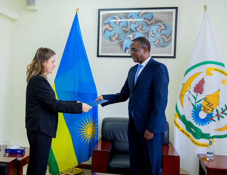 Ms. Einat Weiss presenting copies of credentials on Minister Biruta to represent Israel to Rwanda. 
