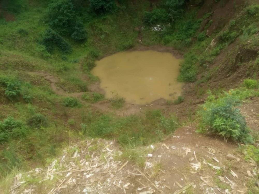  The water-filled open quarry in which the child drowned.  