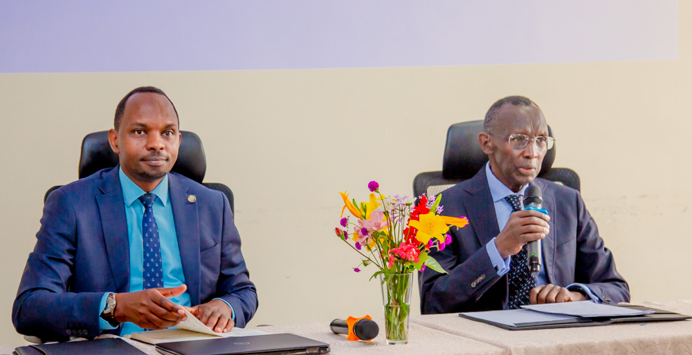 Professor Sam Rugege (holding the microphone) alongside ILPD Rector, Dr. Aimé Muyoboke Kalimunda.