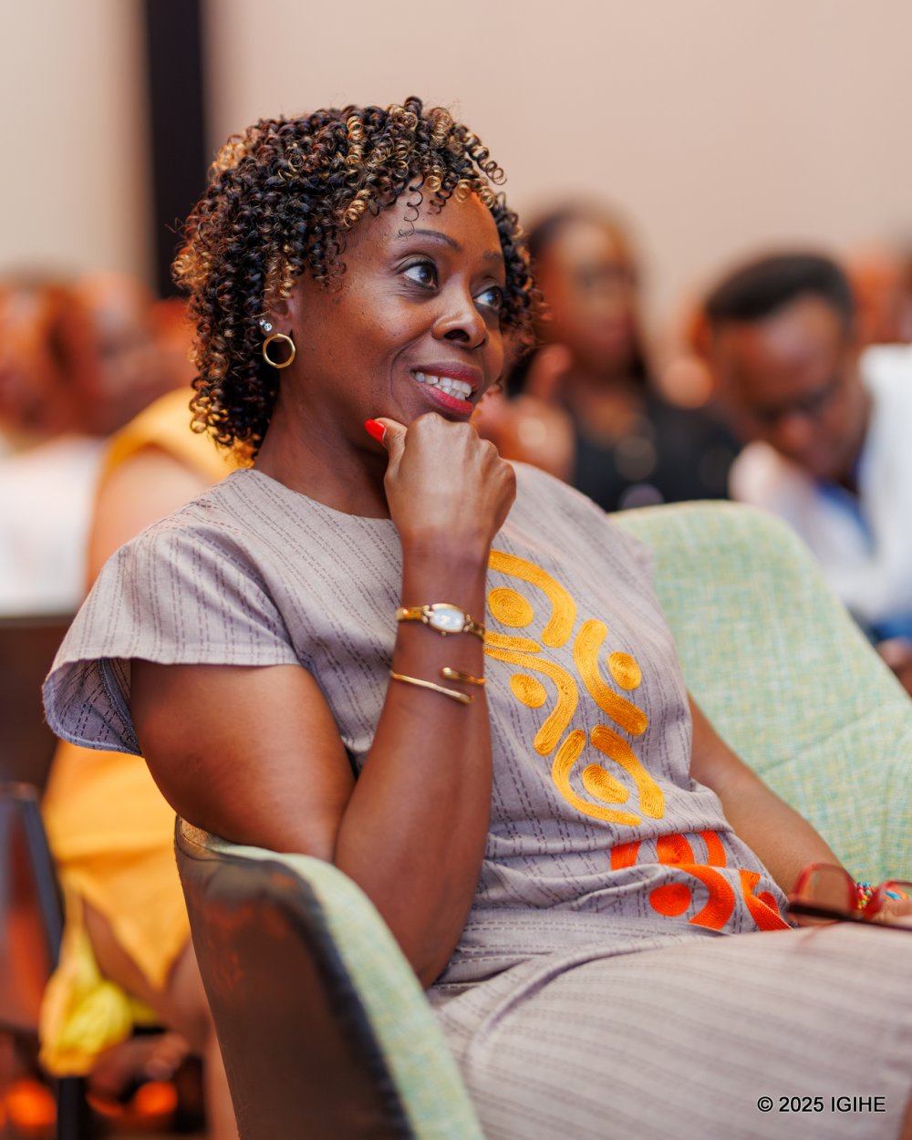 Minister of Public Service and Labour, Ambassador Christine Nkurikiyinka, follows the proceedings at the launch event.
