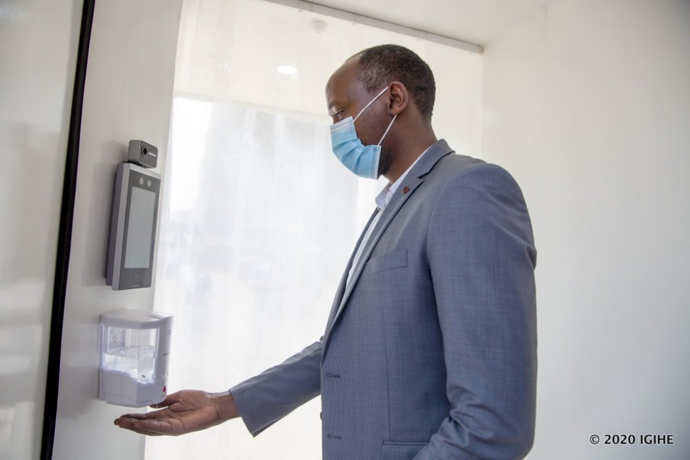 A person only required to stretch out his hands in front of a machine and it release sanitizer 