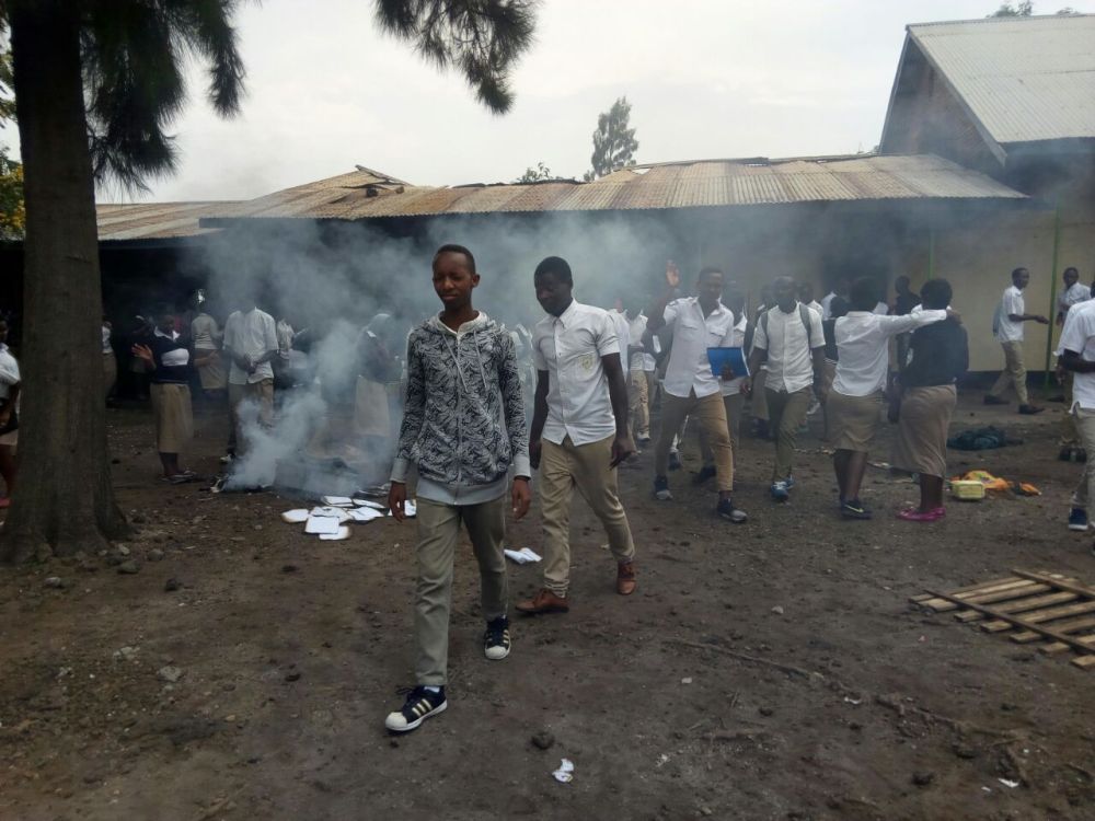 Students escaping the dormitory on fire.