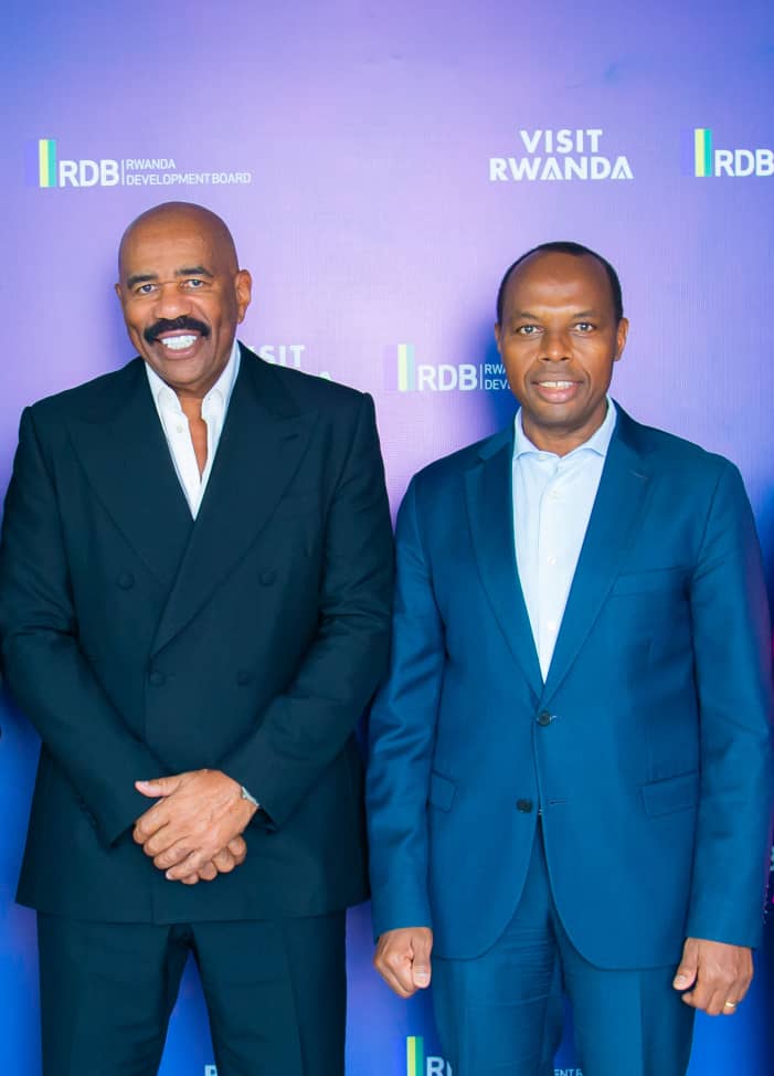 Steve Harvey with the CEO of RDB, Francis Gatare after signing the MoU.