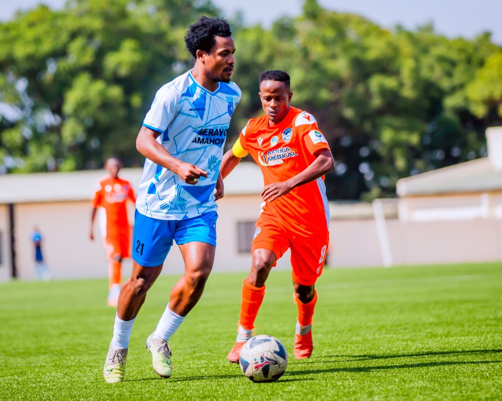 Bigirimana Abedi dribbles past Captain Haruna Niyonzima.