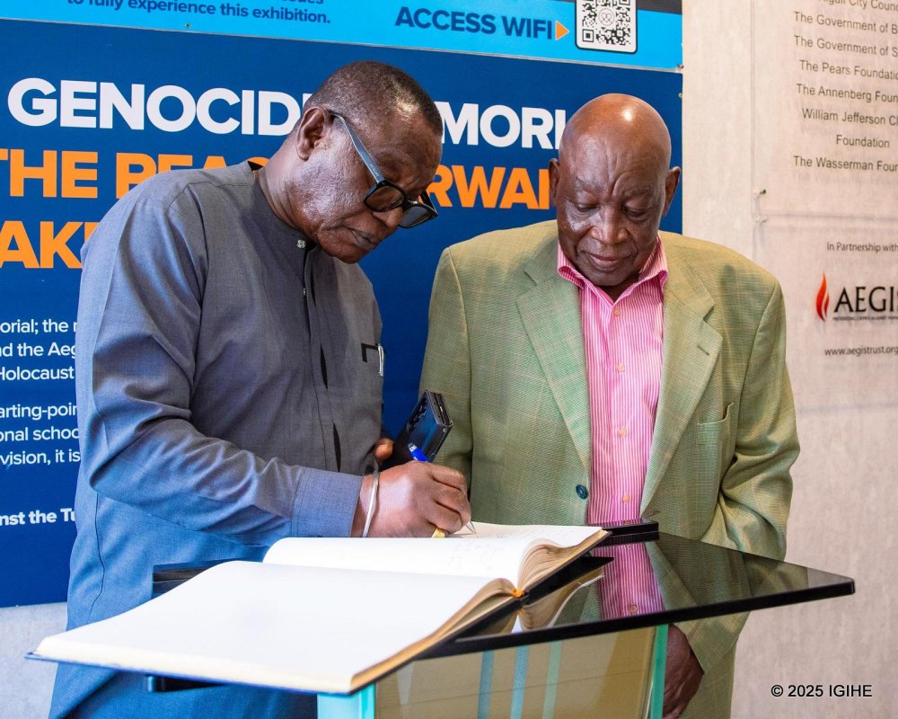 One of veteran soldiers signing the guest book at Kigali Genocide Memorial