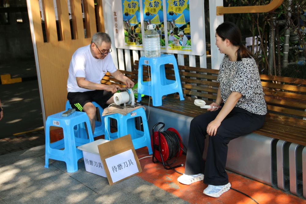 Elders in the community participate in various income-generating activities. This community member sharpens knives, handling up to 50 by noon, earning four Yuan per knife.