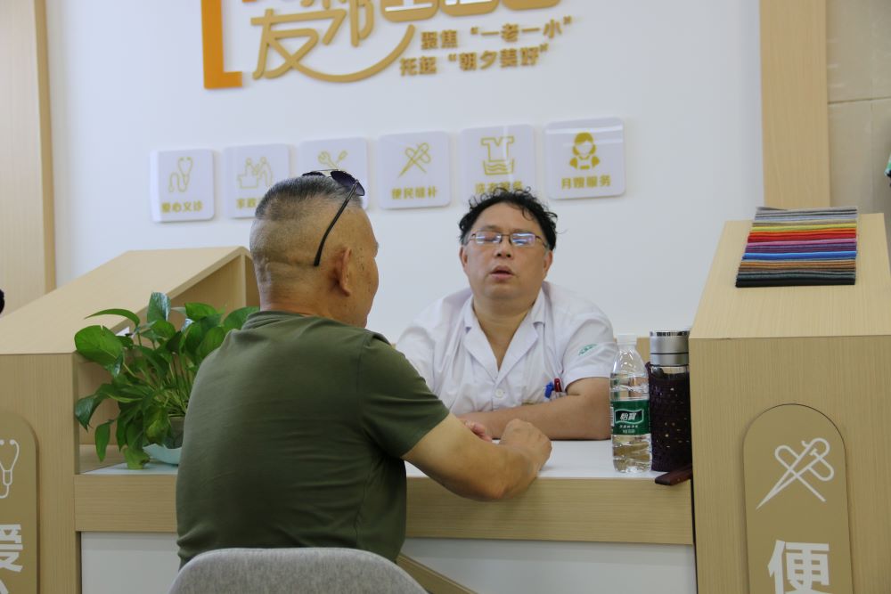 A community member receiving a medical check-up at a volunteer-run clinic.