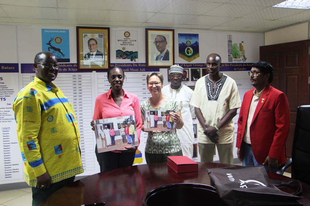 Beth A. Payne given awards of appreciation and a memorial photo of her visit to Kigali Public Library