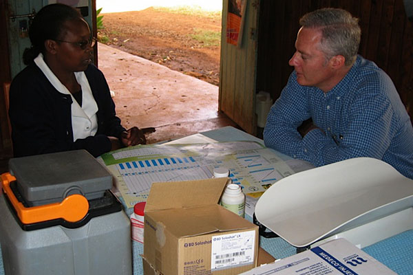 Dr. James Conway, right, leads immunization trainings in sub-Saharan Africa and sees lessons for the United States in Rwanda’s HPV immunization program.
