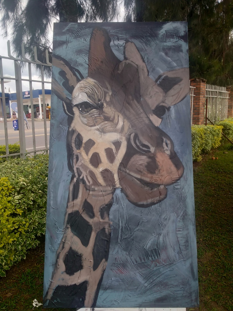 One of the portraits of a giraffe, looks like a painting in which the painter had to first discuss with the muse different alternatives of her pose