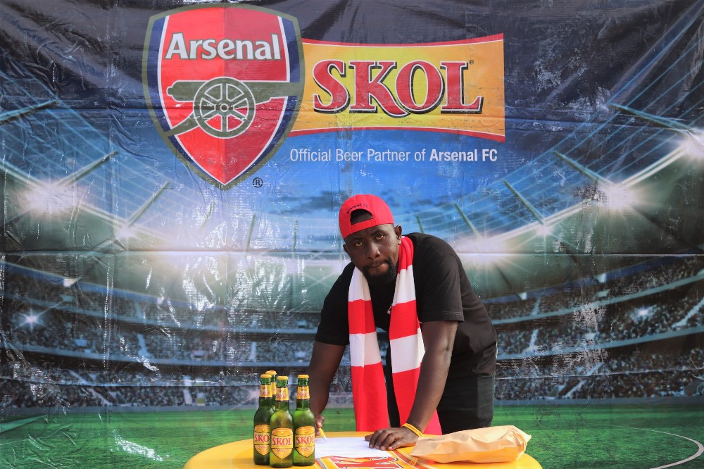 Ndayambaje Jean Marie Vianney signing ticket refund agreement.