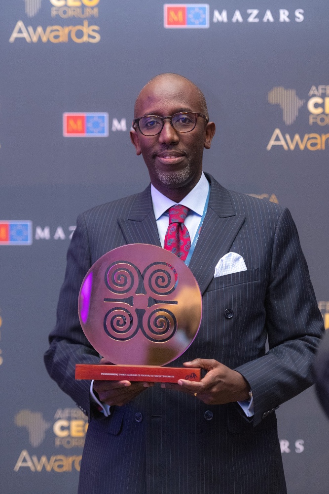 Jean-Claude Karayenzi, Managing Director of Access Bank (Rwanda) Plc, receiving the award on behalf of Access Bank