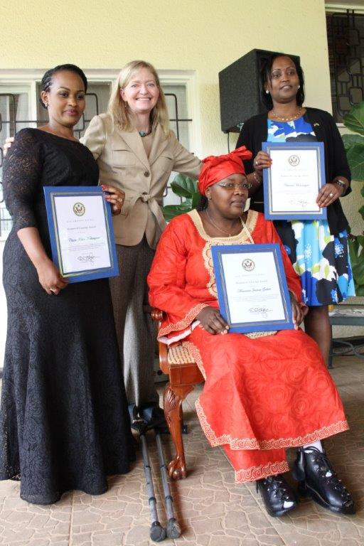 The U.S. Ambassador to Rwanda Erica J. Barks-Ruggles posing for a group photo with honored women.