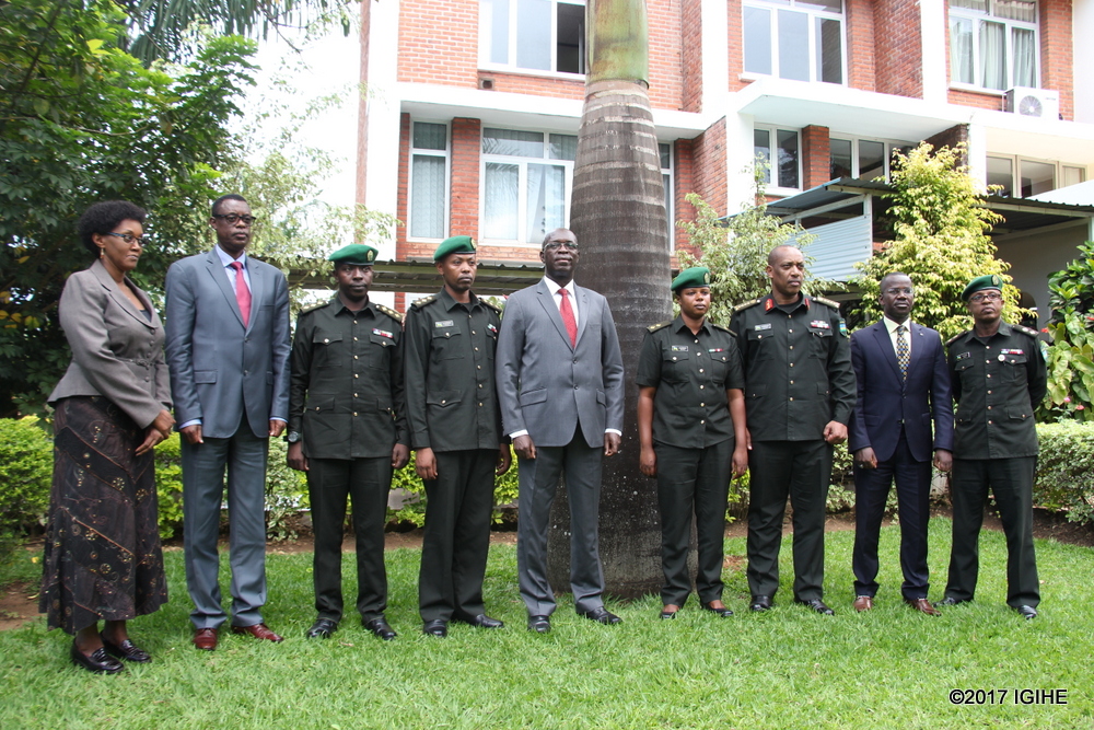New Military Prosecutors pose for a photo with officials including Minister of Cabinet Affairs, Hon Stella Ford Mugabo (first from left), the Minister of Defense Gen James Kabarebe (second from left), Defense Chief of Staff ,Gen Patrick Nyamvumba(third from right) and the Minister of State in charge of Constitutional and Legal Affairs in the Ministry of Justice, Evode Uwizeyimana (second from right).
